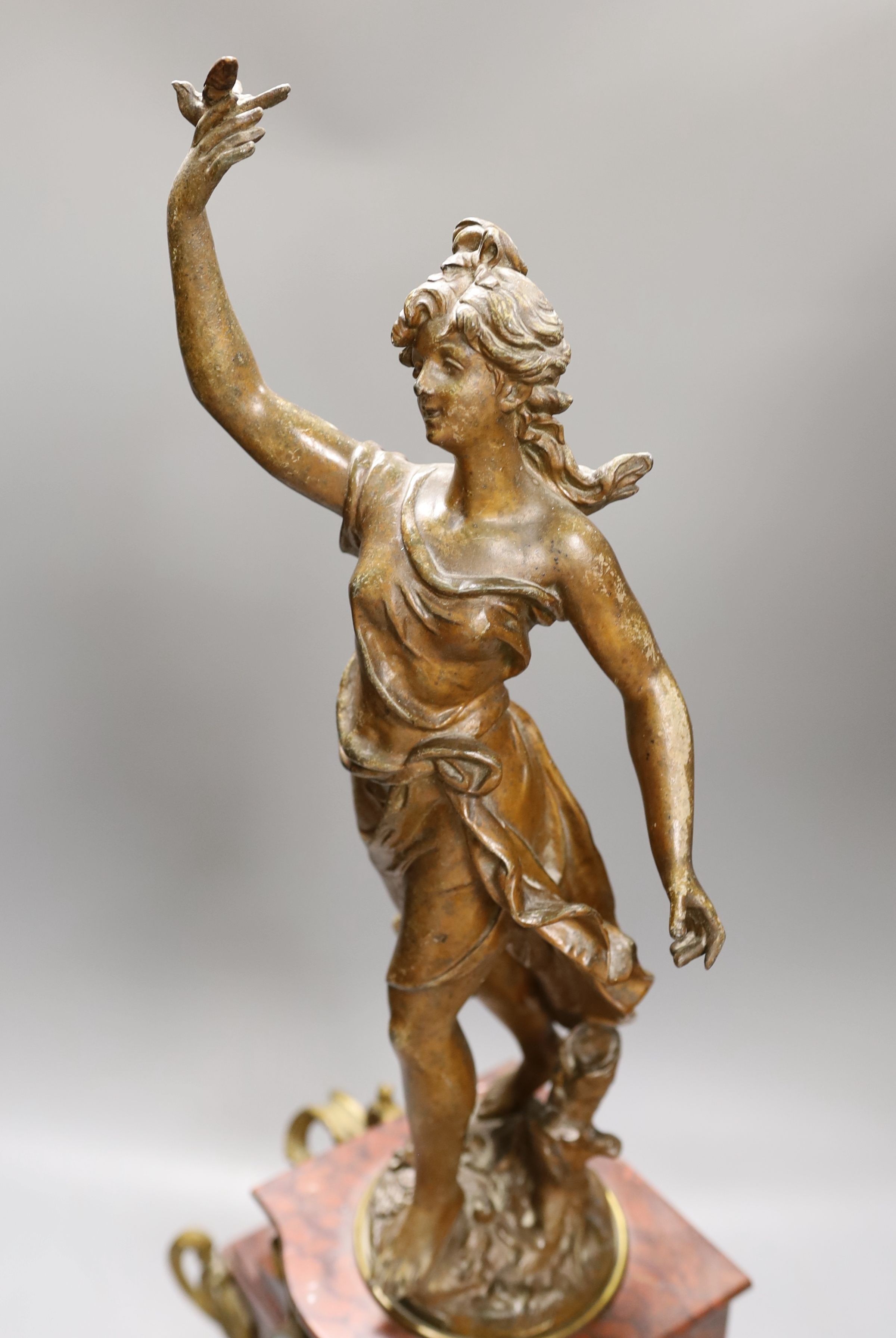 A bronzed spelter and rouge marble figural mantel clock 65cm